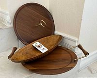 All three walnut serving pieces showing handles and carved bowl