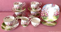 Full set showing teacups, saucers, dessert plates, creamer, sugar bowl