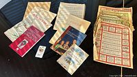 Entire lot spread on piano showing booklets and loose sheets