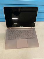 Laptop open showing screen, keyboard, hinge design