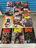 11 Heavy Metal magazines laid out on table in three rows