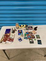 Overall view of all mixed collectibles on table