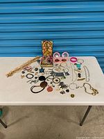 Full table view of all jewellery items and stained-glass box