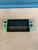 Front view of Nintendo Switch with Joy-Con controllers attached
