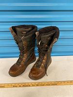 Full view of both boots standing upright