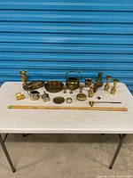 Full lot on table with yardstick for scale