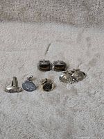 All seven cufflinks front view