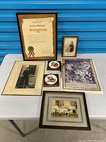 Overall lot layout showing proclamation, photographs, tiles and print