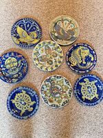 All eight plates arranged to show individual designs