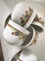 Stacked demitasse cups showing exterior border design