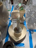 Group of four porcelain items on table