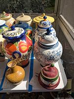 Group shot showing three biscotti jars and snowman candle cover