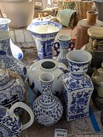 Group view of all five blue and white porcelain vases on floor