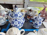 Teapot and sugar bowl front view showing pattern and condition