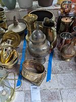 Group showing urn, pitcher, baskets within blue tape