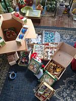 Overhead view of all boxed ornament sets spread on floor