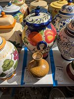 Cookie jar with lid and small vase in lot