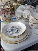 Group view showing pitcher, stacked saucers and cups