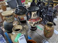 Group showing two Greek style urns and brass floral vase