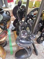 Group of Kenyan soapstone figure sculptures on display shelf