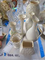 Group view of all Lenox porcelain vases and the clear crystal vase