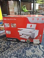 Front of retail box showing Lexmark X2580 printer image and features
