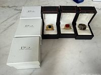 Overview of three rings in Daniel Steiger boxes