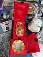 vase and bowl in open red velvet boxes