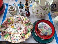 Group view showing vases, ornate tray, plates stack, lidded box