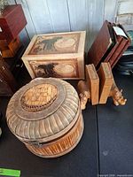 Group showing elephant box, round bamboo box, rhino bookends, photo albums