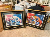 Both framed prints side by side on floor