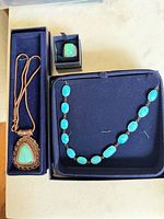 All three jewellery pieces in boxes