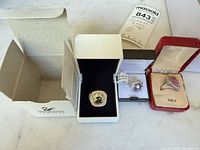 All three rings in their boxes showing overall contents