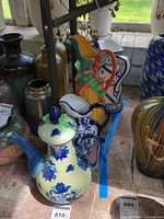 Group shot of teapot and three pitchers