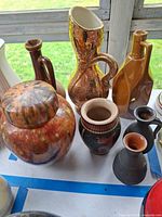 Group of assorted vases, pitchers and lidded jar