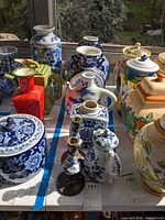 Group shot showing all porcelain pieces and candlesticks on table