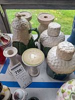Group showing teapot, two jars, candlestick, pedestal