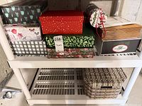 Group shot of assorted decorative gift boxes on shelf