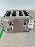 Front view showing four slots, dual control panels, levers and brand logo