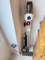 Vacuum on charging dock with motor head, wand and charger