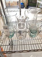Group shot of all seven glass pieces on shelf