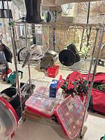 Front view of chrome wire shelving unit with items on shelves