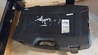 Closed black Husky molded plastic carry case with handle
