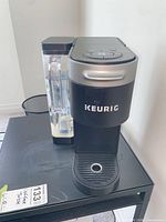 Full view of Keurig coffee maker showing reservoir and drip tray