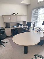 full L-shaped desk with hutch, chair and equipment on top