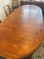 Full view of extended teak dining table top