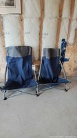Two Pacific Pass folding camping chairs side by side