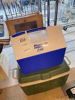 Igloo Playmate Elite cooler stacked on Rubbermaid cooler