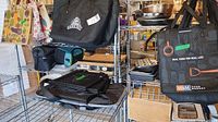 Multiple reusable shopping bags on shelving including M&M Food Market and Farm Boy