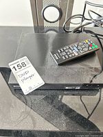 Front and top view of Sony player showing brand logo and remote
